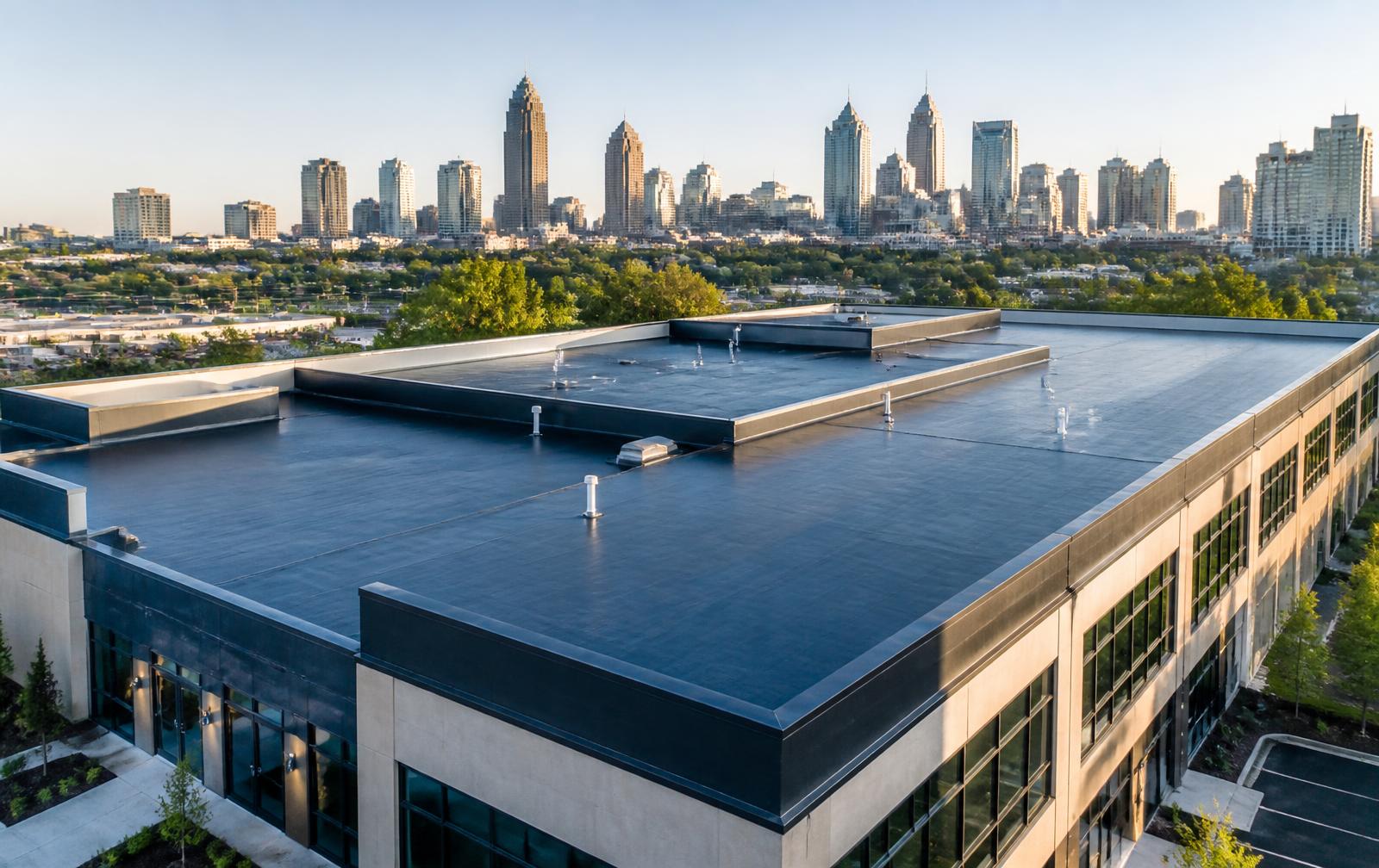 Commercial flat roofing system overlooking the Atlanta skyline